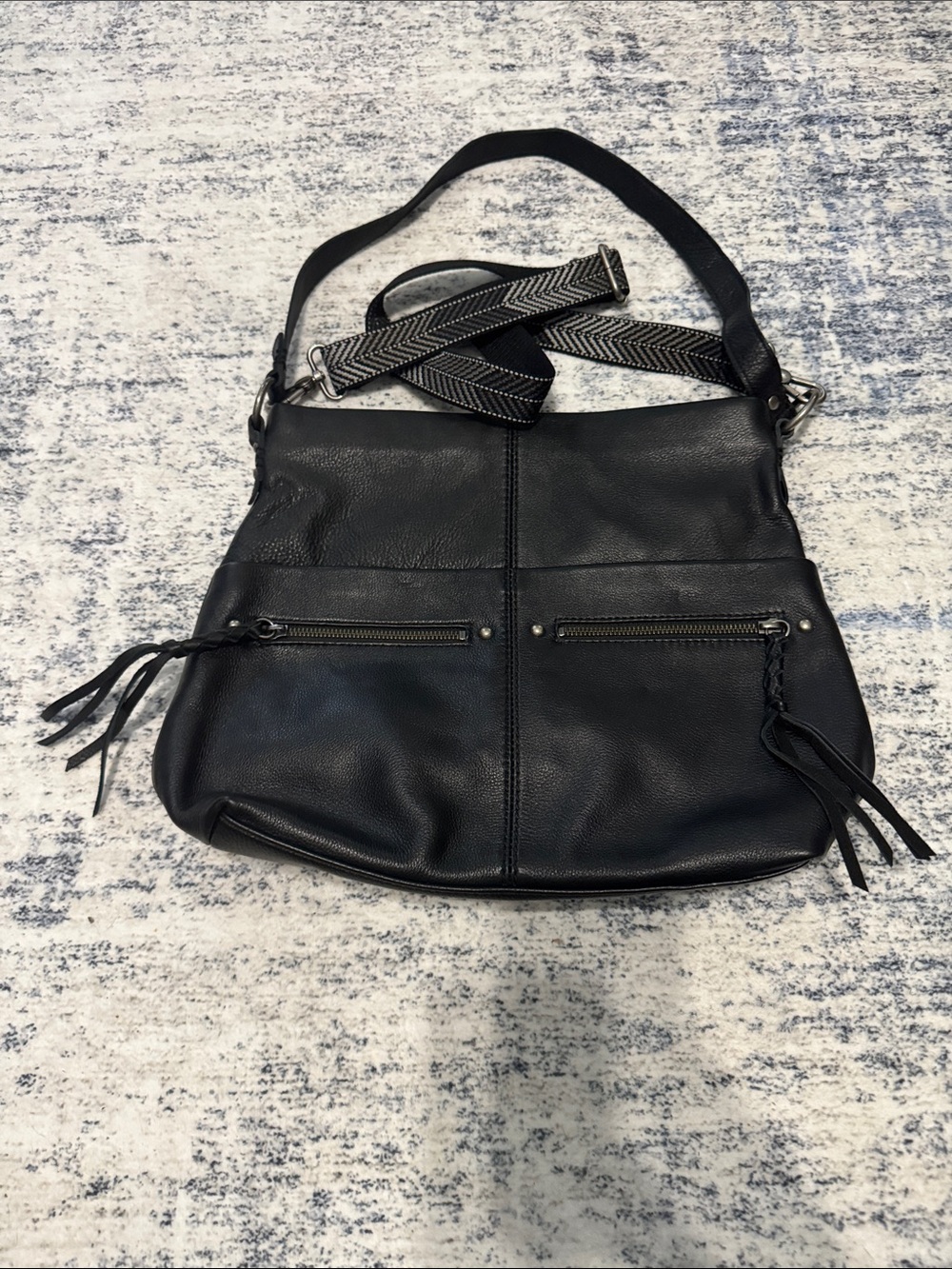 The Sak Black Leather Crossbody with Woven Strap and Front Zips